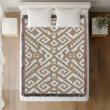 Chitto Southwestern Cotton Blend Blanket Throw in Beige and Off-White, on a bed