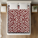 Chitto Southwestern Cotton Blend Blanket Throw in Red and Off-White, on a bed