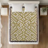 Chitto Southwestern Cotton Blend Blanket Throw in Dull Gold and Off-White, on a bed