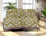 Chitto Southwestern Cotton Blend Blanket Throw in Dull Gold and Off-White, draped over a chair
