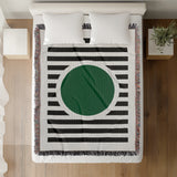 Circle Abstract Cotton Blend Blanket Throw in Green, Black and Off-White, on a bed