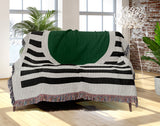 Circle Abstract Cotton Blend Blanket Throw in Green, Black and Off-White, draped over a chair