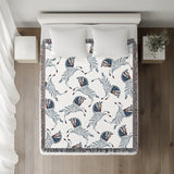 Ciro Zebra Cotton Blend Blanket Throw in Blue and Off-White, on a bed