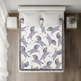 Ciro Zebra Cotton Blend Blanket Throw in Periwinkle and Off-White, on a bed