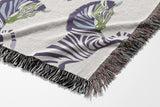Ciro Zebra Cotton Blend Blanket Throw in Periwinkle and Off-White, draped over a chair