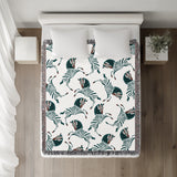 Ciro Zebra Cotton Blend Blanket Throw in Teal and Off-White, on a bed