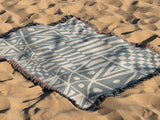 Cocodili Abstract Print Cotton Throw Blanket in Gray and Beige, outdoors