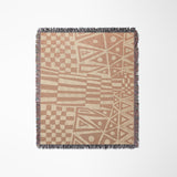 Cocodili Abstract Print Cotton Throw Blanket in Rust and Beige, laid flat