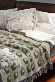 Cube Cotton Blend Blanket Throw in Chartreuse, on a bed
