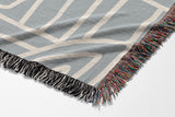 Diof Abstract Print Cotton Throw Blanket in Gray and Beige, side view