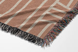 Diof Abstract Print Cotton Throw Blanket in Beige and Rust, side view