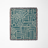 Diof Abstract Print Cotton Throw Blanket in Teal and Beige, laid flat