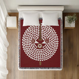 Mossi African Mask 100% Cotton Blanket in Red, on a bed
