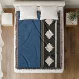 Ector Southwestern Cotton Blend Blanket Throw in Blue, Black and Off-White, on a bed