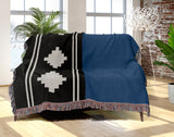Ector Southwestern Cotton Blend Blanket Throw in Blue, Black and Off-White, draped over a chair