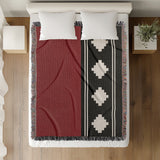 Ector Southwestern Cotton Blend Blanket Throw in Red, Black and Off-White, on a bed