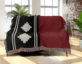 Ector Southwestern Cotton Blend Blanket Throw in Red, Black and Off-White, draped over a chair