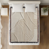 Eko Cotton Blend Blanket Throw in Beige, on a bed
