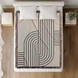 Eko Cotton Blend Blanket Throw in Black, on a bed