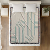 Eko Cotton Blend Blanket Throw in Turquoise, on a bed