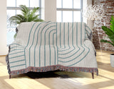 Eko Cotton Blend Blanket Throw in Turquoise, draped over a chair