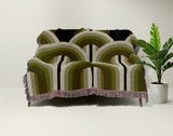 Farni Cotton Blend Blanket Throw in Chartreuse, draped over a chair