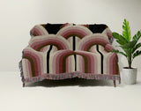 Farni Cotton Blend Blanket Throw in Red, draped over a chair