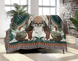 Faya Tiger Cotton Blend Blanket Throw in Green and Orange, draped over a chair