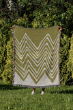 Addai Abstract Triangle Pattern Blanket Throw in Chartreuse, outdoors