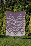 Addai Abstract Triangle Pattern Blanket Throw in Purple, outdoors