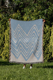 Addai Abstract Triangle Pattern Blanket Throw in Sky Blue, outdoors