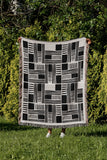 Anala Abstract Cotton Throw Blanket in Black, outdoors