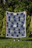 Anala Abstract Cotton Throw Blanket in Blue, outdoors