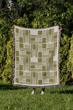 Anala Abstract Cotton Throw Blanket in Chartreuse, outdoors