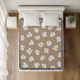 Atia Cheetah Print Cotton Throw Blanket in Beige and Blue, on a bed
