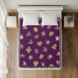Atia Cheetah Print Cotton Throw Blanket in Purple and Beige, on a bed