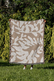 Booker Floral Cotton Throw Blanket in Beige, outdoors