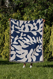 Booker Floral Cotton Throw Blanket in Blue, outdoors