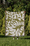 Booker Floral Cotton Throw Blanket in Chartreuse, outdoors