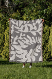 Booker Floral Cotton Throw Blanket in Gray, outdoors