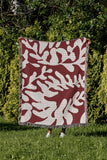 Booker Floral Cotton Throw Blanket in Red, outdoors