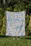 Booker Floral Cotton Throw Blanket in Sky, outdoors