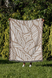 Caro Floral Cotton Throw Blanket in Beige, outdoors