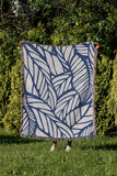 Caro Floral Cotton Throw Blanket in Blue, outdoors