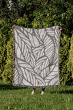 Caro Floral Cotton Throw Blanket in Gray, outdoors