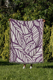 Caro Floral Cotton Throw Blanket in Purple, outdoors