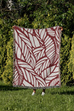 Caro Floral Cotton Throw Blanket in Red, outdoors