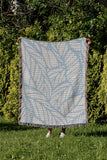 Caro Floral Cotton Throw Blanket in Sky, outdoors