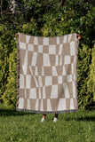 Colette Checkered Cotton Throw Blanket in Beige, outdoors
