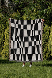 Colette Checkered Cotton Throw Blanket in Black, outdoors